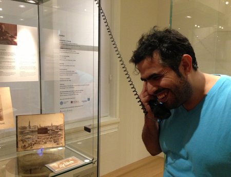 Saudi Artists Ahmed Mater listening to 1908 recordings of music in Jeddah at the Museum of Antiquities in Leiden, the Netherlands. Copyri