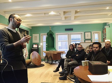 Saudi Artist Abdulrahim Turkistan explaining work at a presentation in Greenbox Museum