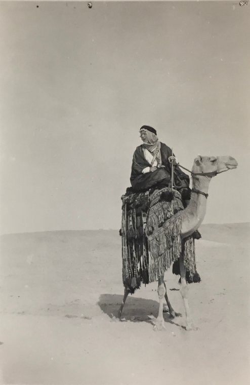 Haji Mohammed Husein-el-Mahdi (1891-1972), a.k.a. Arthur Neervoort van de Poll, a Dutch-Saudi convert to Islam, on camelback. Small photo taken around 1930, in a collection of former Dutch consul and envoy in Jeddah, C. Adriaanse, in the Dutch national archives, where unidentified. Reproduction by Aarnout Helb in 2017 for Greenbox Museum - Heritage section. Original source citation: Nationaal Archief, Den Haag, Collectie 406 Adriaanse, 1886-1985, nummer toegang 2.21.205.01, inventarisnummer 109.
